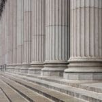 Social proof. Intellectual Property Litigation Attorney. Stone colonnade and stairs detail.