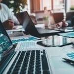 Social proof. Strategy Consultant. Business people working at a conference table with laptops, and notepads.