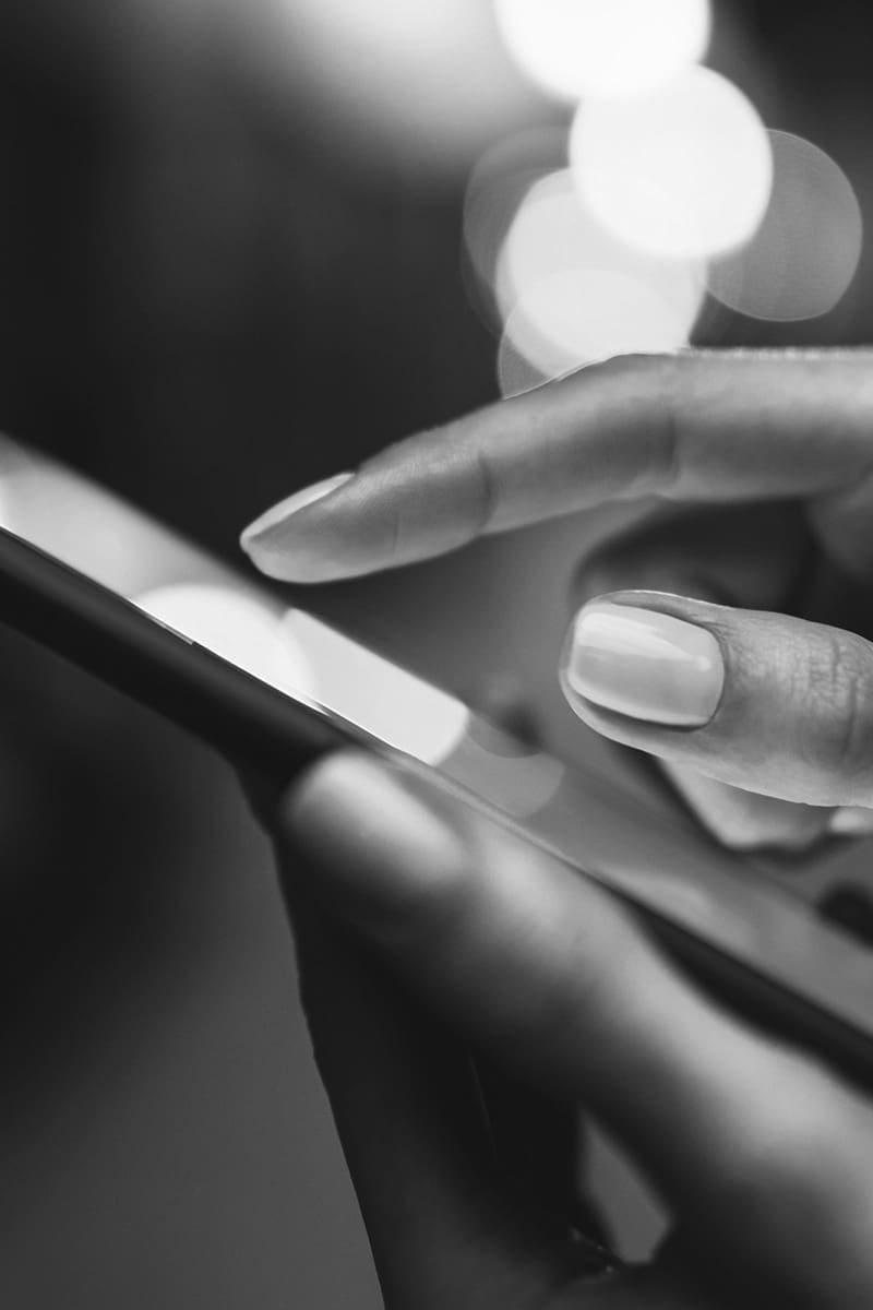 Share your business with the world—a pointing finger on a smartphone close-up.